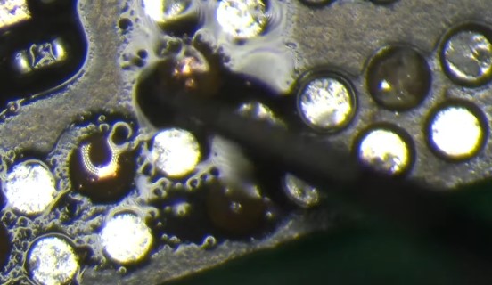 File:Ripped motherboard pad.jpg